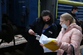 The passenger presents the documents to the conductor