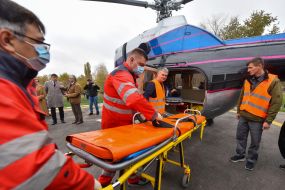 Transportation of a conditionally patient from an ambulance car to an ambulance helicopter