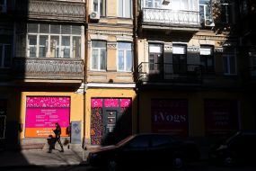 The girl walks near the store