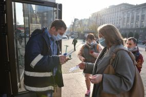 Checking COVID-certificates at the entrance to McDonald's in Kiev