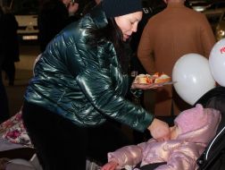 The woman feeds the girl