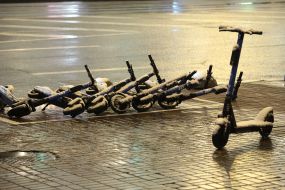 Snow-covered electric scooters during the first snow in Kiev