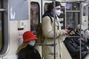 People in protective masks in the subway
