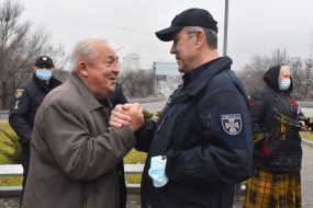 Laying flowers at the monument to the "Heroes of Chernobyl"