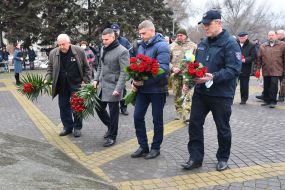Laying flowers at the monument to the "Heroes of Chernobyl"