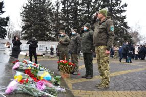 Laying flowers at the monument to the "Heroes of Chernobyl"