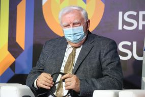 Summit participant in a medical mask