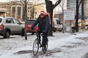 The man rides a bicycle