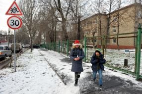 Children walk on the sidewalk