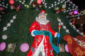 Figure of Santa Claus near the New Year tree