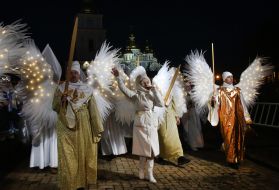 Volunteers in archangels and angels costumes
