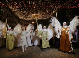 Volunteers in archangels and angels costumes