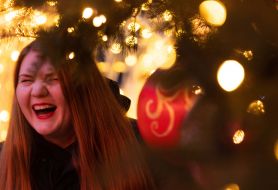 Girl near the christmas tree