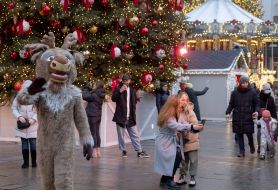 People taking selfie near the christmas tree