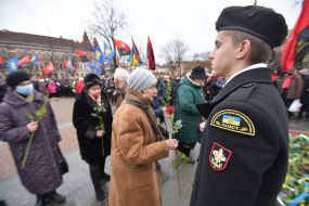 Laying flowers at the monument to Stepan Bandera