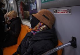 Woman in a protective mask in the subway