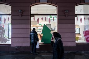 Passers-by near a shop window
