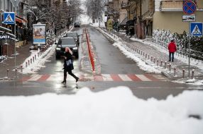 A woman crosses the road
