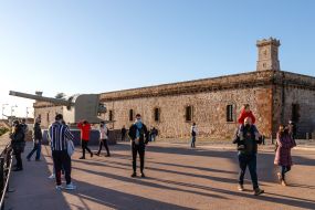 Tourists in protective masks visit the Montjuic Fortress in Barcelona