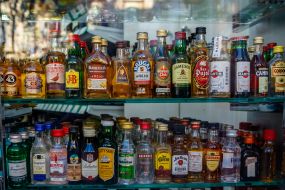 Mini bottles with alcoholic beverages in the window of one of the shops in Barcelona