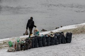 Garbage collection on the banks of the river Uzh