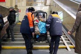 Porters near a man in a wheelchair at the Central Railway Station