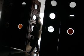 A woman enters the building of the Central Railway Station