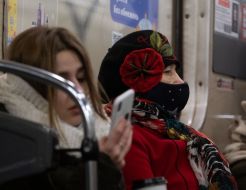 Woman in a protective mask in a subway car