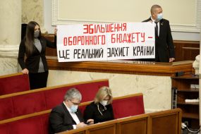 People's deputies holding a poster