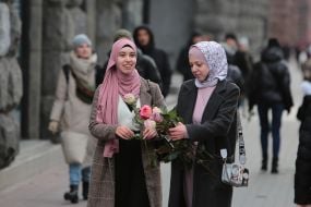 The participant of the action presents flowers
