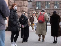 An elderly woman begs for alms