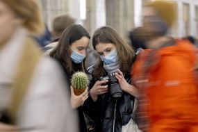 Girls holding a cactus and a camera