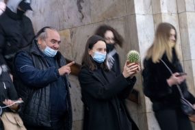 Girl holding a cactus