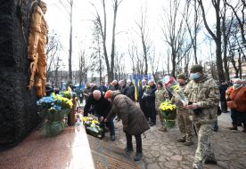 Laying flowers at the memorial to soldiers killed in Afghanistan