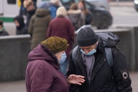 A man with a woman in medical masks