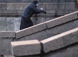 An elderly woman wearing a face mask