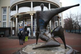 People stand in line at the ATM