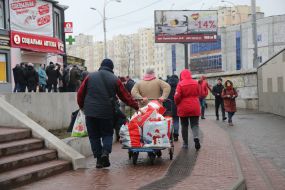 People stand in line at the ATM