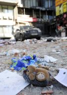 Destruction near a residential building damaged by shelling