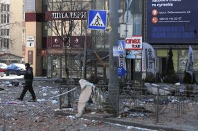 Destruction near a residential building damaged by shelling