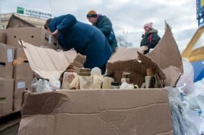 Volunteers prepare Molotov cocktails
