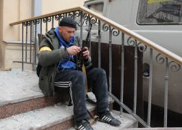 Representative of the Terrorist Defense on the stairs of the building after the rocket attacks by the Russian military occupiers