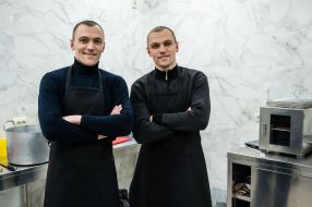 Marian and Roman Sushinski prepare stew for UAF servicemen in the kitchen of their meat shop in Drohobych