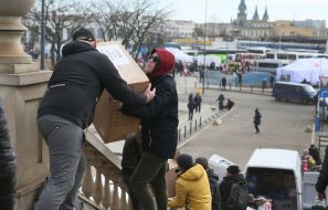 Volunteers work on the territory of the refugee center in Lviv