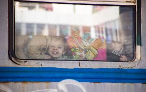 Children in the evacuation train at the train station