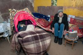 A woman with a child hiding in a basement in Kharkiv
