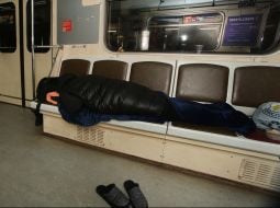 A man sleeps in a subway car in Kyiv