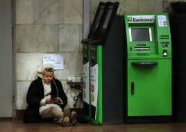 The girl charges a mobile phone in the subway in Kiev
