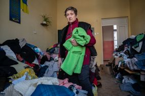 Clothes for migrants are laid out in the classroom of one of the schools in Drohobych