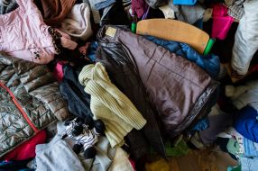 Clothes for migrants are laid out in the classroom of one of the schools in Drohobych